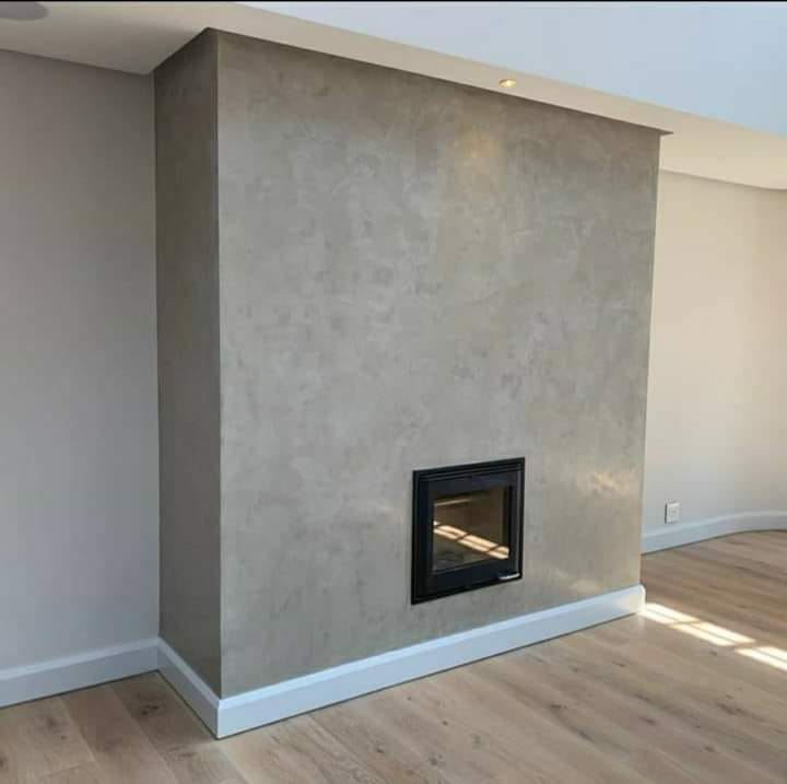 Project photo showing a textured wall finish around a fireplace feature