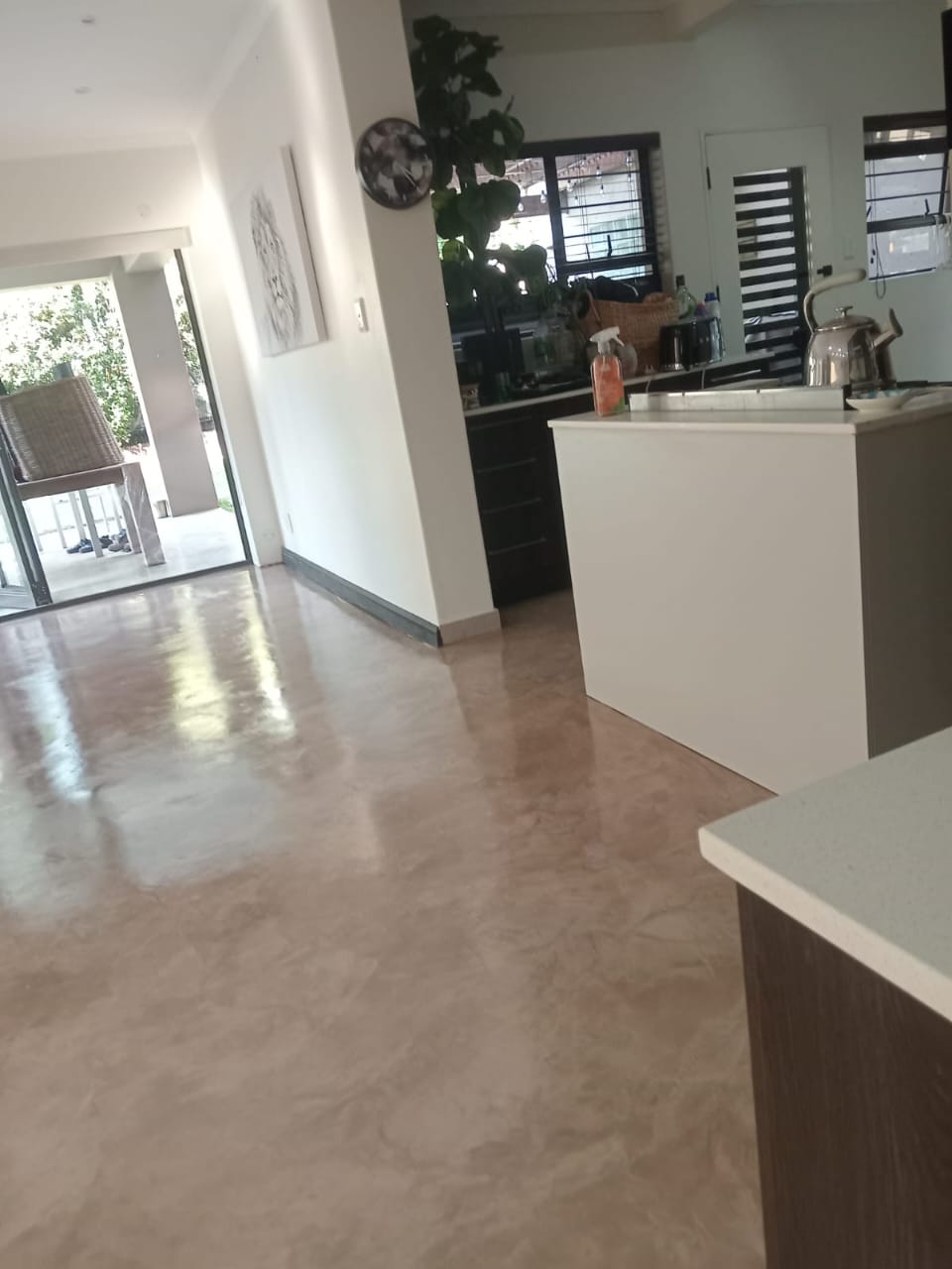 Project photo showing a finished floor in a furnished open-plan living area